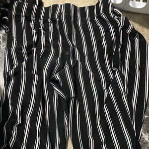 Black and white striped bell bottom leggings